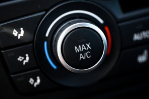 Close-up view of the air conditioning unit buttons in a car. 