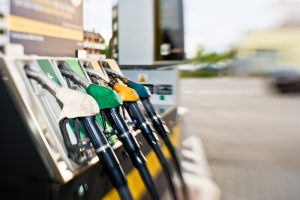 A close-up view of a gas pump with various types of gas nozzles.