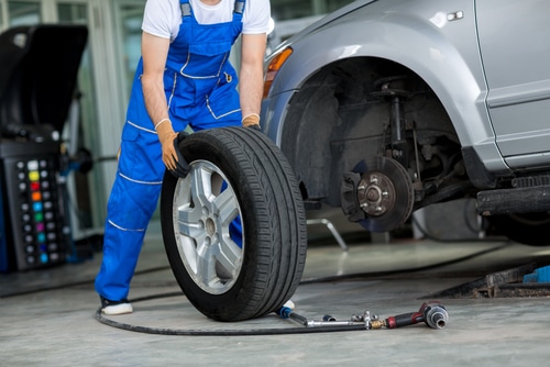 New tires being put on car