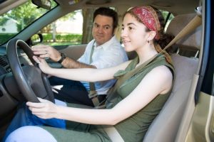 Promo graphic for Scott's Automotive with the title text "Talk to Your Teen About Distracted Driving," emphasizing safe driving practices and awareness.
