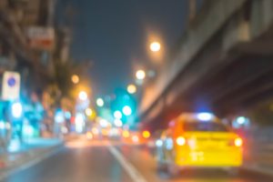A view from a car that is blurry, as if the driver has blurry vision.