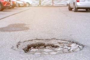 Avoid potholes on the road for car safety