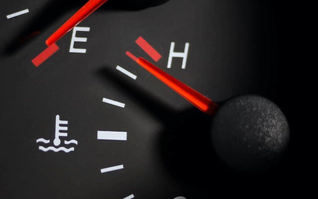Car engine temperature sensor close up arrows
