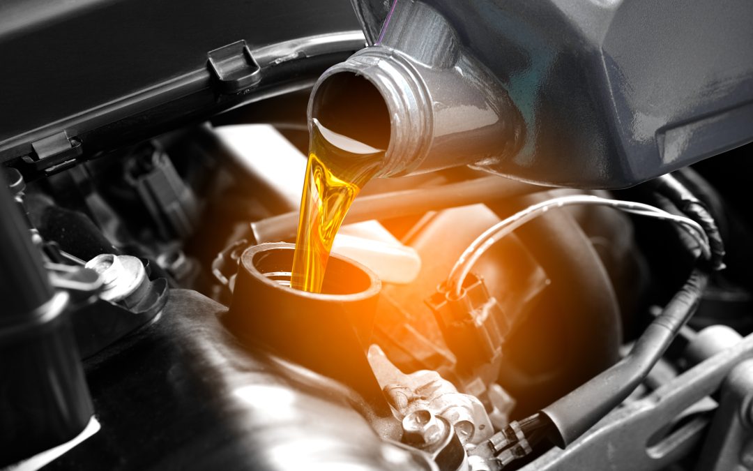Refueling and pouring oil quality into the engine motor car Transmission and Maintenance Gear .Energy fuel concept.